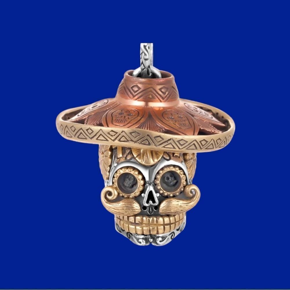 GOLD AND SILVER TONE STRAW HAT SKULL